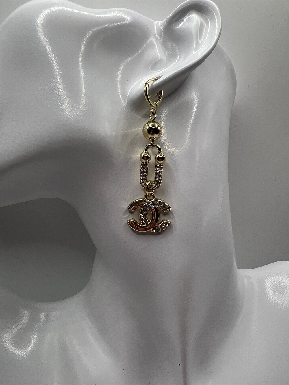 1446. Gold-Tone Dangle Earrings with Interlocking Stamped Logo Charm. - Picture 2 of 5